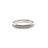 A 9ct white gold half eternity ring inset with dia