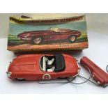 Lincoln, boxed 1960s remote controlled E type jaguar, missing windshield