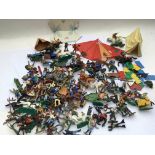A collection of Timpo, Britains figures including cowboys and Indians, medievil and military