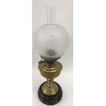 A brass oil lamp with glass shade, approx 60cm