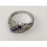 A white gold, sapphire and chip diamond ring.Appro