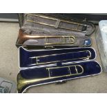 Two cased trombones including a Blessing.