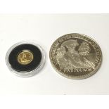 A small gold coin Royal Lion. and a silver Five po