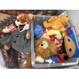 A box of vintage children's TV character soft toys