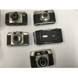 A collection of cameras and lenses including a Zei