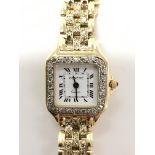 A ladies Geneve quartz 14ct gold wristwatch. The s