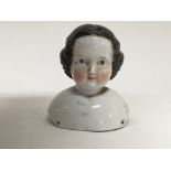 A large Early 19th Century or Victorian porcelain dolls head 15cm.