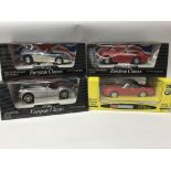 A collection of boxed diecast vehicles, 1:18 scale