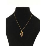 A 9ct gold, modernist pendant necklace set with an
