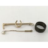 A gold and pearl stick pin, a silver rings and rid