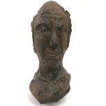 A carved wood bust by Estonian born Scottish sculp