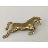 A 9ct gold brooch of a leaping horse.Approx 11.2g,