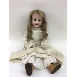 A German Armand Marseille bisque headed doll.Appro