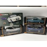 A collection of boxed 1:18 scale diecast vehicles