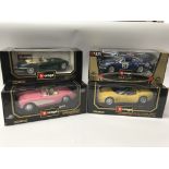 A collection of boxed diecast vehicles , 1:18 scal