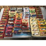 A collection of boxed diecast vehicles including C