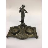 A art nouveau ink stand surmounted with a maiden