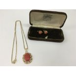 A 9ct gold and coral pendant necklace with matchin