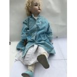 A vintage large porcelain head and limbs doll, ful