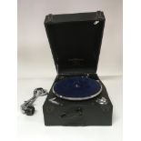 A Columbia portable gramophone with a small collection of 78 records. In need of restoration, a/f.