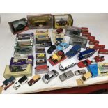 A collection of boxed and loose Diecast vehicles,