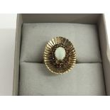 A vintage 9ct gold ring of oval shape set with an