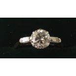 An 18ct gold diamond solitaire ring. Approx O