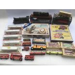 A collection of boxed and loose diecast vehicles i
