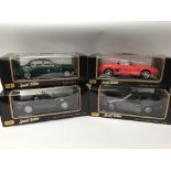 A collection of boxed 1:18 scale diecast vehicles