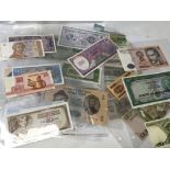 A collection of world banknotes some uncirculated.