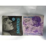 Two signed 12inch singles by The Smiths comprising