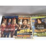 A collection of signed music and entertainment publications including Hugh Hefner, Chris Evans,