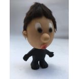 An unusual soft rubber toy possibly of Paul McCartney as a Beatle, approx 19cm high.