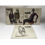 Three 12inch singles by Suede comprising two signe