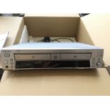 A boxed Sony RCD W100 compact disc recorder, with