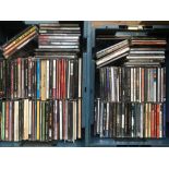 A collection of CDs by various artists including N