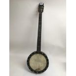 A banjo marked J.F. Dawson.