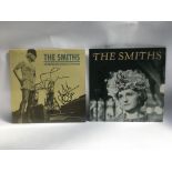 Two signed 12inch singles by The Smiths comprising