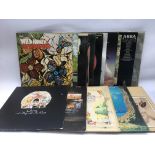 A collection of LPs by various artists including Q