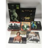 A collection of Iggy Pop & The Stooges CD sets and a DVD.