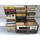 A Wien 8 track cassette player with a collection o