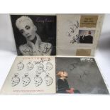 Four signed Eurythmics 12inch singles, one bearing