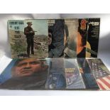 A collection of Johnny Cash LPs including 'John R