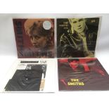 Four records by The Smiths comprising three 12inch