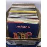A box of LPs and 12inch singles by various artists