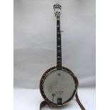 An Ibanez 5 string banjo with hard shell fitted ca