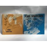 Two signed 12inch singles by The Smiths comprising