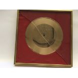 A framed 7 inch gold disc of 'Antmusic' by Adam &