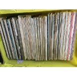 Four boxes of jazz and classical LPs.