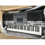 A Yamaha 9000 keyboard with retail box, stand and